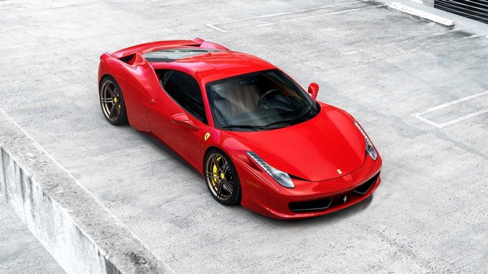 Red Ferrari 458 Italia parked in a lot