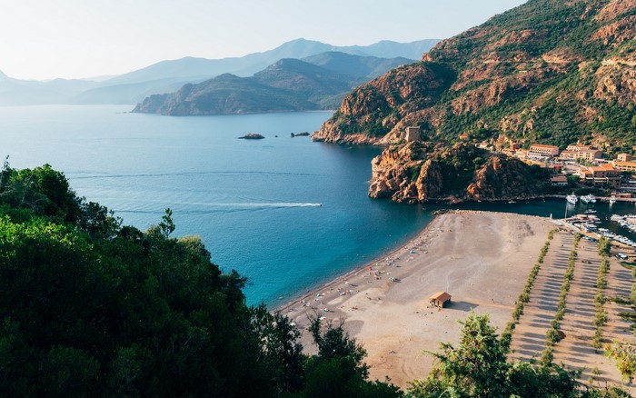 Coastal town with beach and bay in Corsica