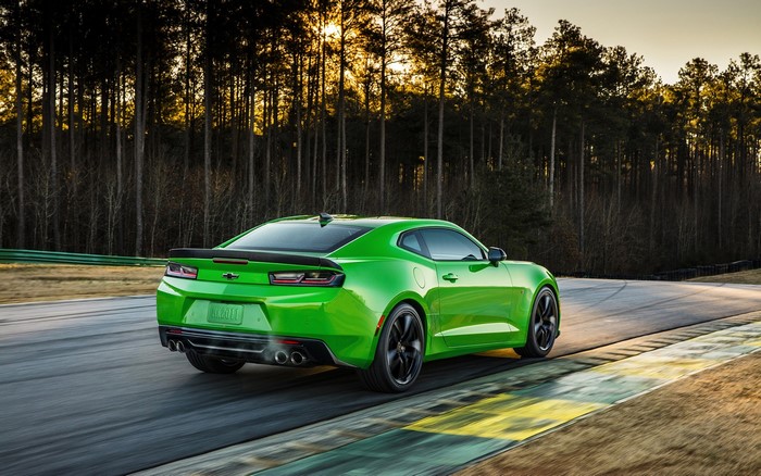 Green Chevrolet Camaro on a race track