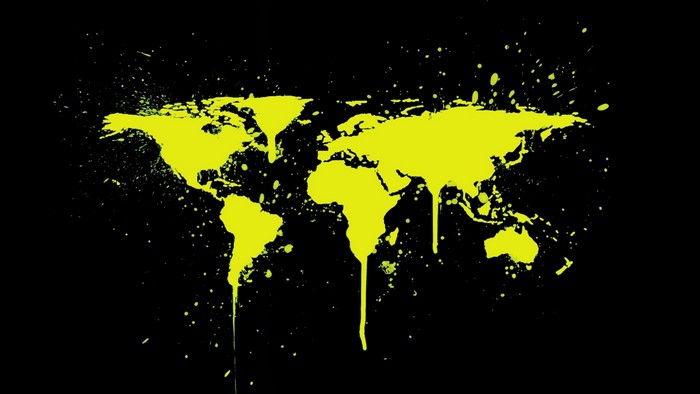 Yellow world map splattered on black background
