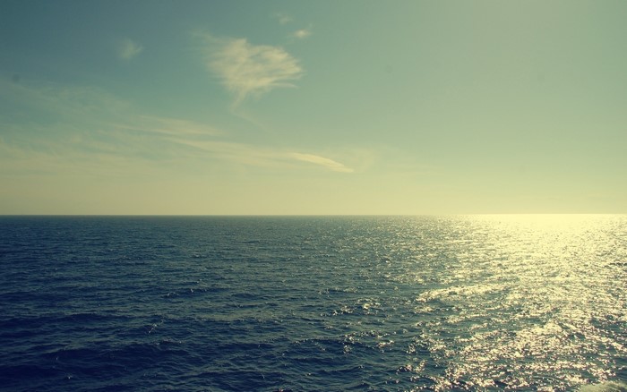 Ocean horizon with sunlit water and sky