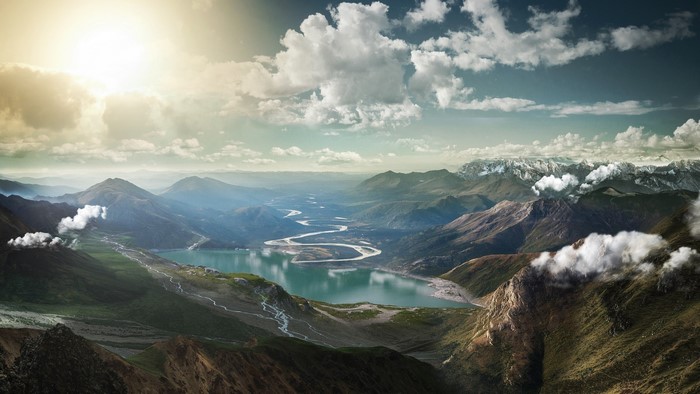 Majestic mountain range with a winding river and lake
