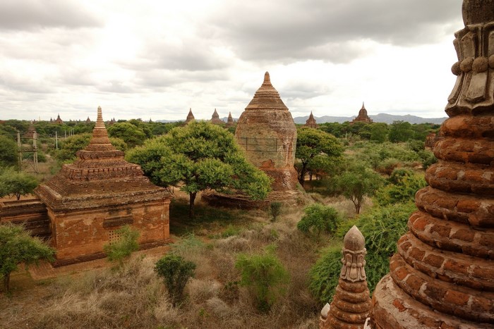 Ancient brick stupas and temples in a green landscape