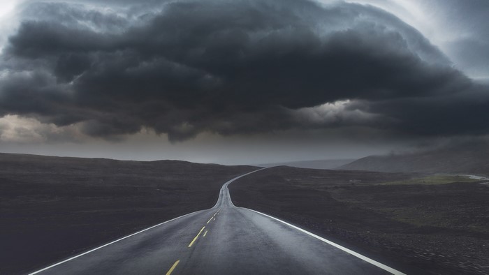 Stormy sky over a desolate road landscape