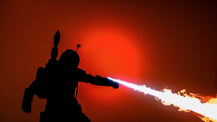Boba Fett from Star Wars firing flamethrower