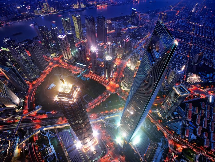 Aerial view of Shanghai cityscape at night with skyscrapers and lights