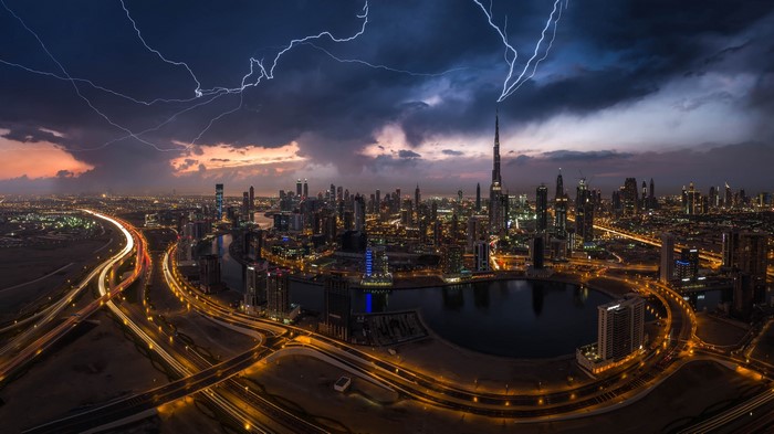 Lightning strikes over Dubai cityscape during a storm