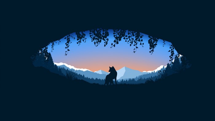 Wolf in a cave overlooking mountains at sunset