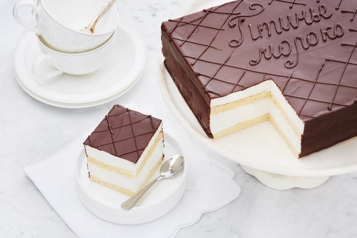Chocolate cake with cream and inscription