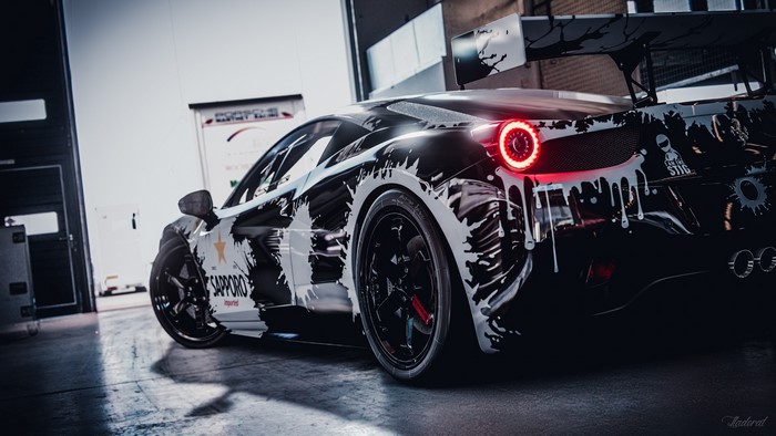 Ferrari 458 Italia with paint splatter livery in garage