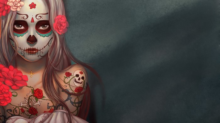 Woman with Sugar Skull face paint and tattoos