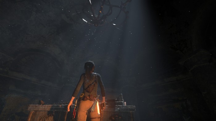 Lara Croft from Rise of the Tomb Raider in a dark chamber