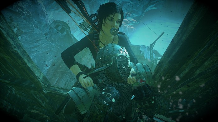 Lara Croft from Tomb Raider fighting an armored enemy underwater