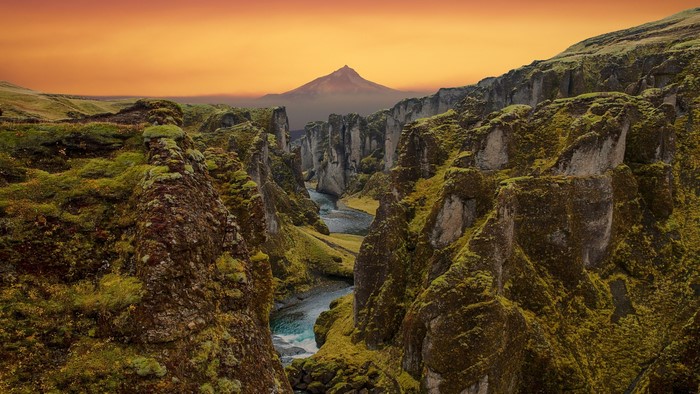 Canyon river landscape with mountain at sunset