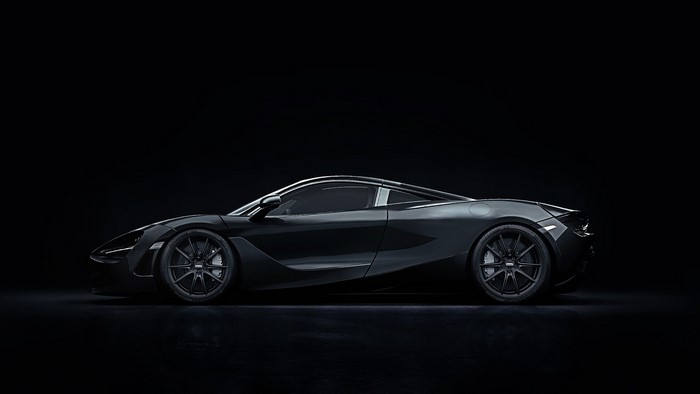 Black McLaren 720S sports car on a black background