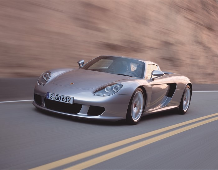 Porsche Carrera GT driving on a road
