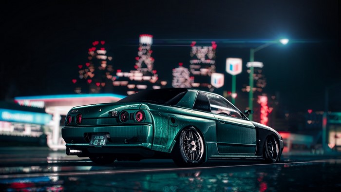 Nissan Skyline GT-R R-32 on a wet street at night