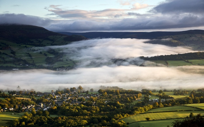Valley village shrouded in morning mist