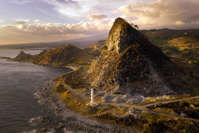 Lighthouse on a rocky coast in Bataan at sunset