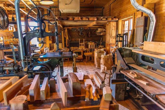 Woodworking workshop with vintage machinery and lumber