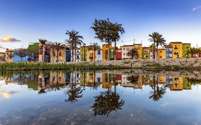 Colorful houses reflected in water