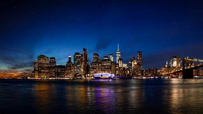 New York City skyline at night with Brooklyn Bridge