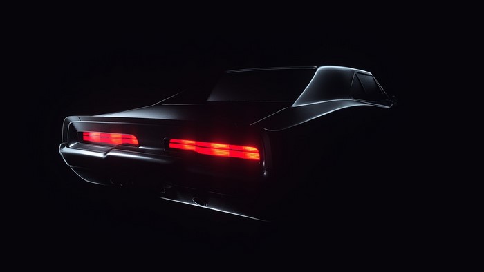 Rear view of a black Dodge Charger with illuminated taillights