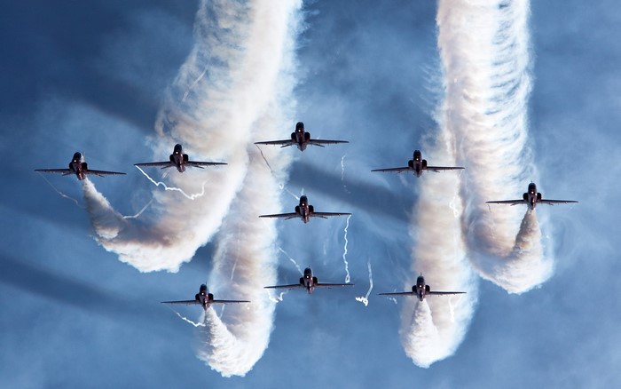 Patrouille de France jets performing aerobatics with smoke trails