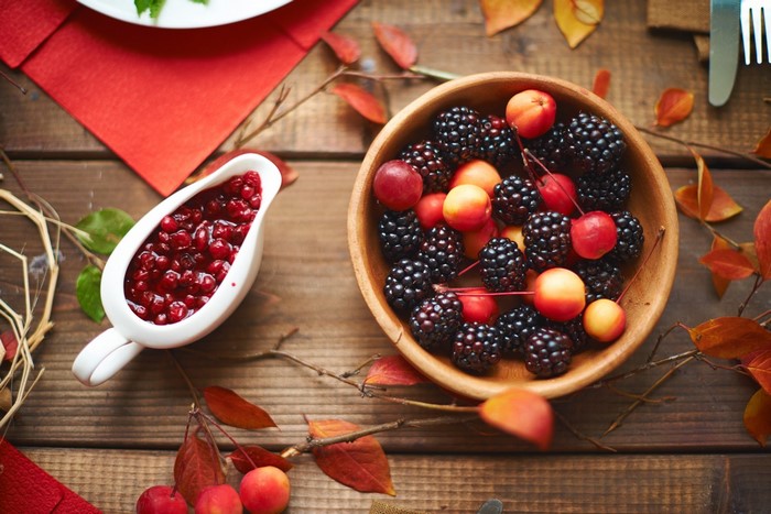 Bowl of blackberries and cherries with cranberry sauce