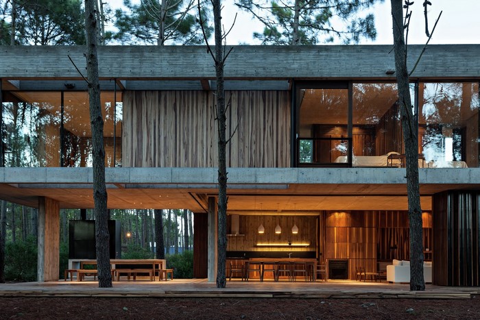 Modern concrete and wood house in a forest