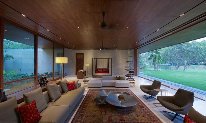 Modern living room with large windows and outdoor view