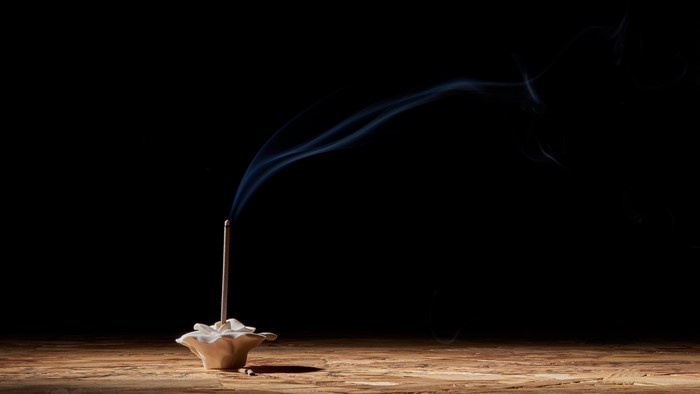 Incense stick burning with smoke