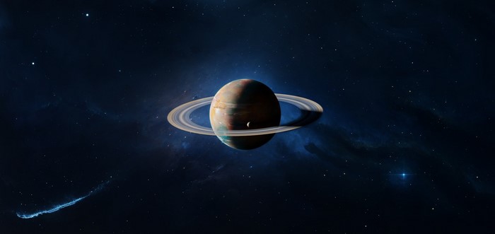 Saturn with rings and a moon in deep space