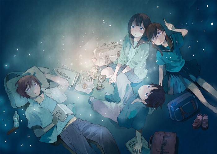 Four friends lying on the ground at night