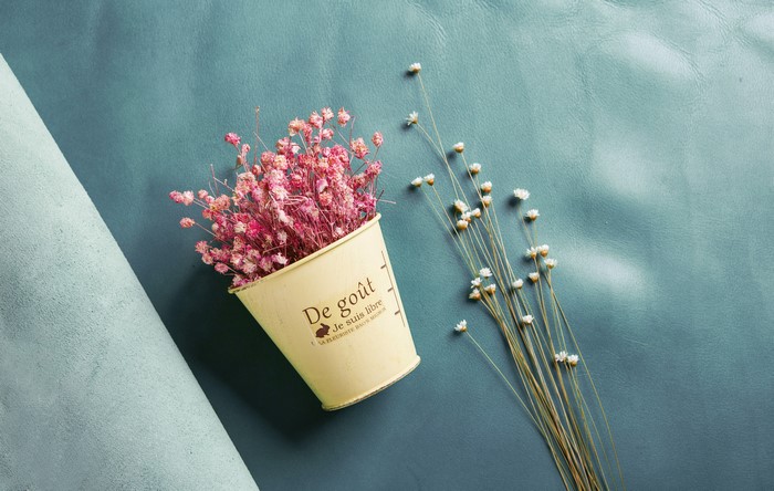 Dried pink flowers in a pot with dried white flowers