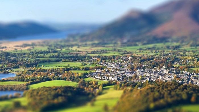 Tilt shift landscape of a town and mountains