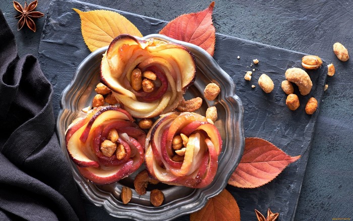 Apple roses with nuts on a platter