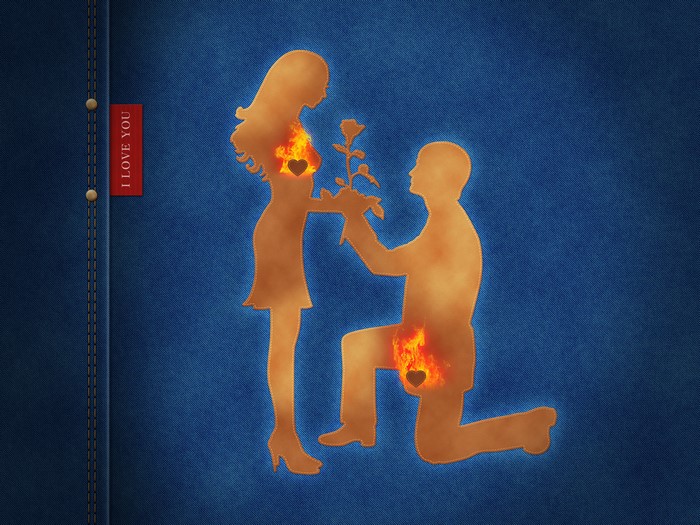 Couple with burning hearts on denim background
