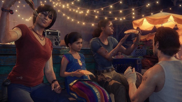 Chloe Frazer, Nadine Ross, and others eating pizza