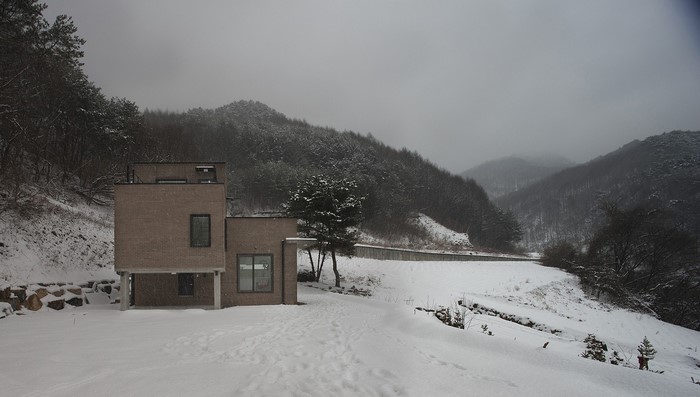 Modern house in a snowy mountain landscape