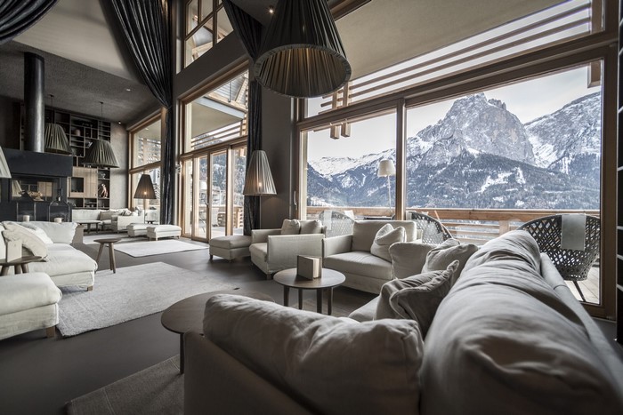 Living room with fireplace and mountain view