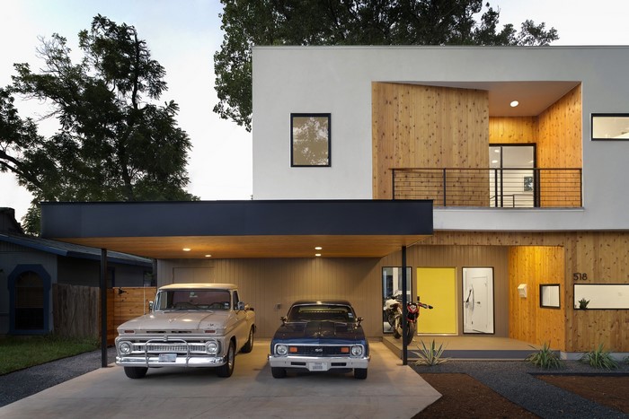 Modern house with classic cars and motorcycle