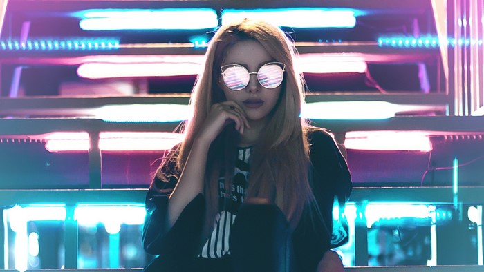 Woman with glasses in neon lights
