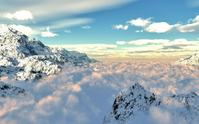 Snow-capped mountains above clouds under a blue sky