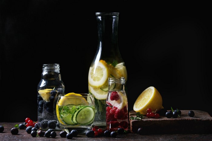 Infused water with berries, lemon, and cucumber