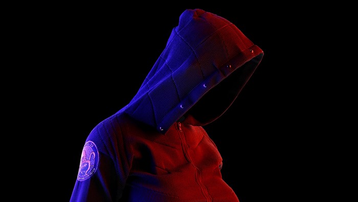 Person in Hooded Jacket with Patch