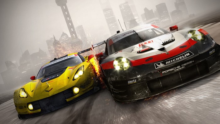 Porsche and Corvette race cars in a city