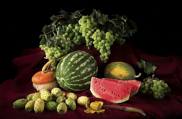 Still life with watermelon, melon, grapes, and prickly pears