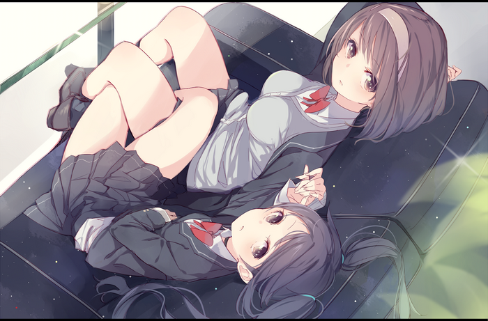 Two anime girls in school uniforms lying on a couch