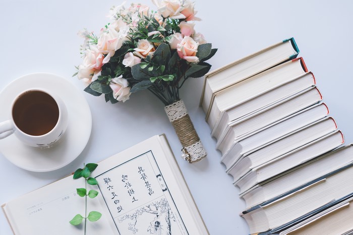 Books, Coffee Cup, and Flowers